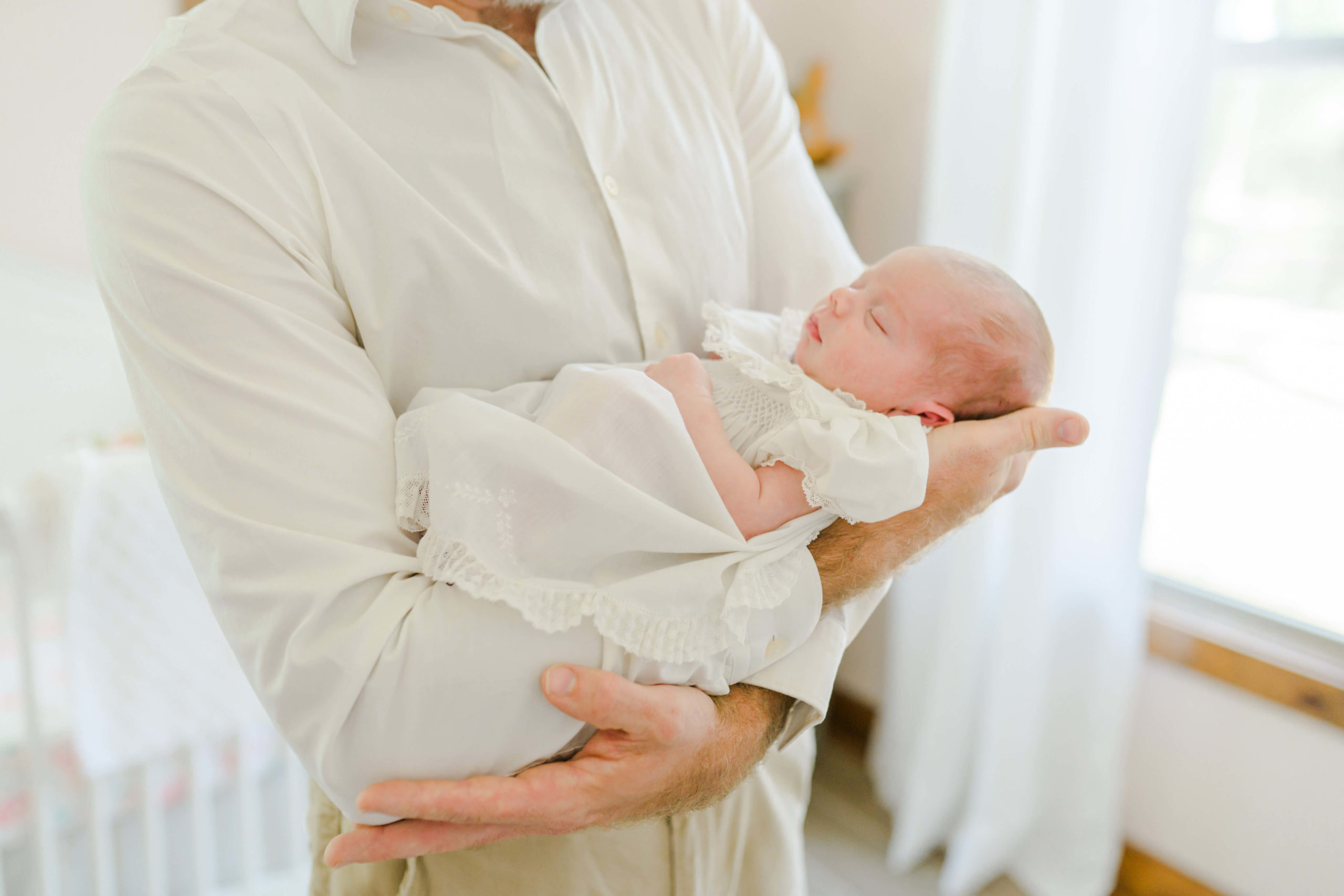 Dad holding baby during lifestyle session