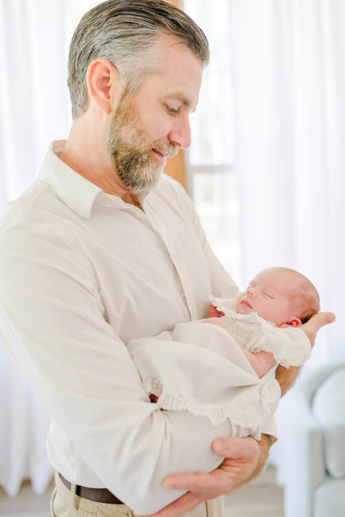 Dad holding baby during newborn session