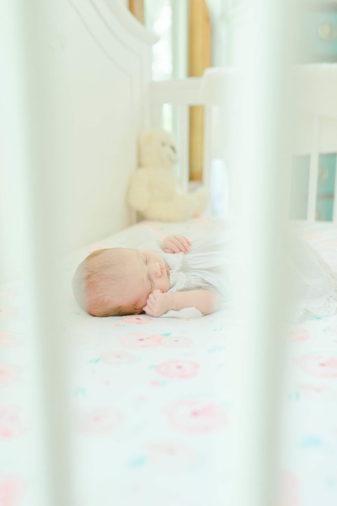 Picture of baby in crib during lifestyle newborn session