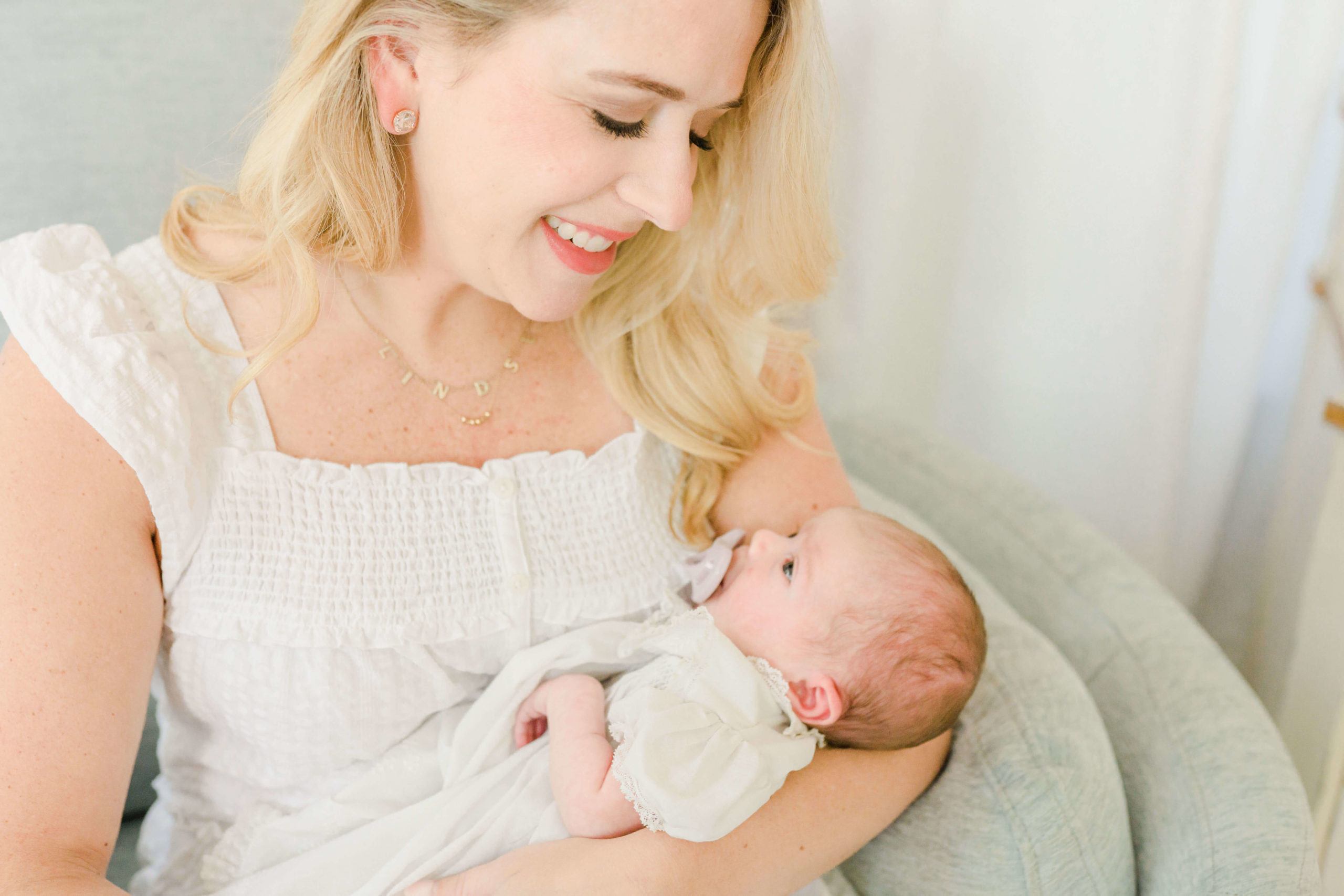 Mom holding baby during lifestyle session