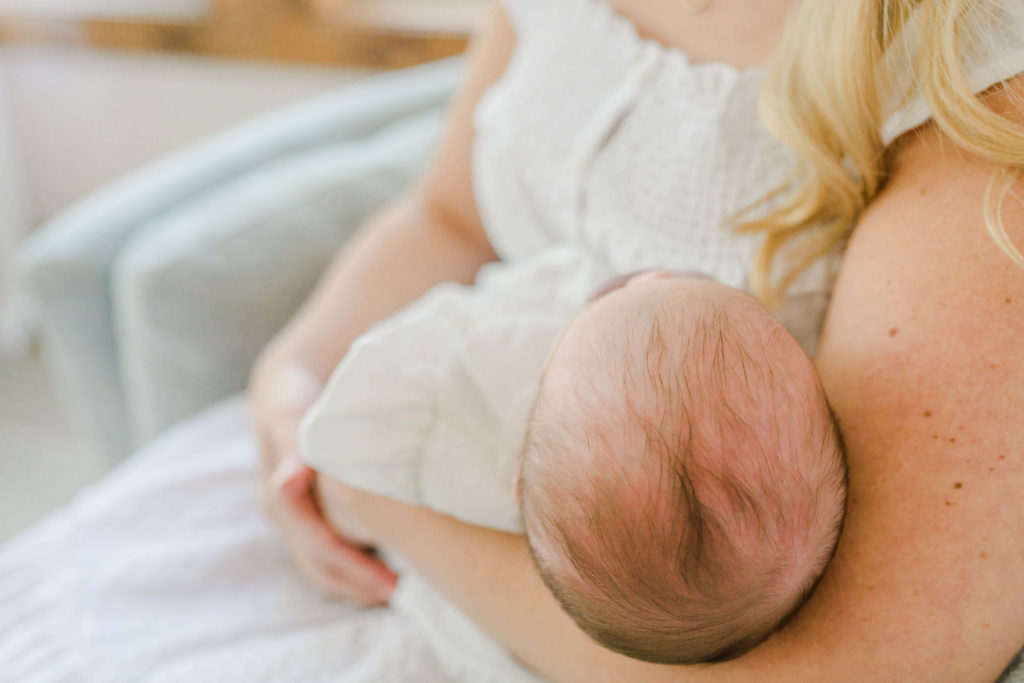 Detail of baby head during lifestyle newborn session