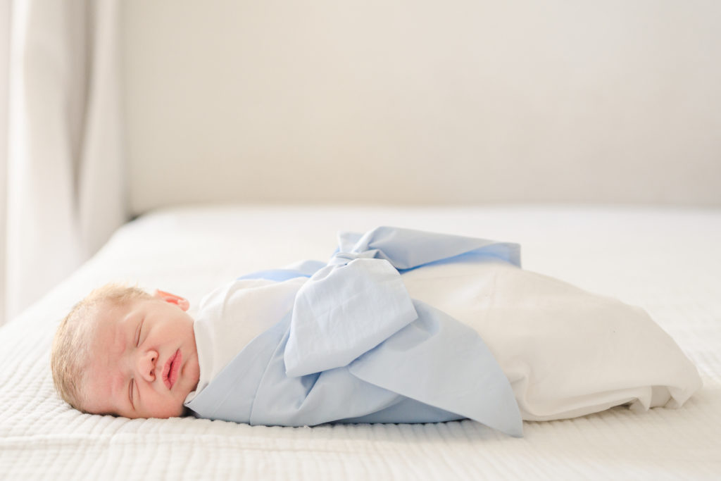 Baby sleeping on bed