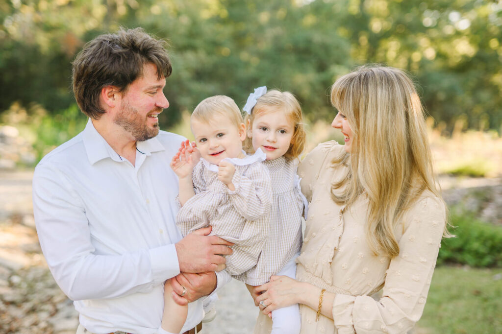 coordinated family outfits for spring photos with soft complementary colors