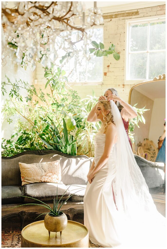 Anna gets ready with her mother at The Raymond Venue before her wedding in Raymond, Mississippi.